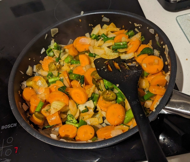 Spicy Cauldron Stew veggies in pan